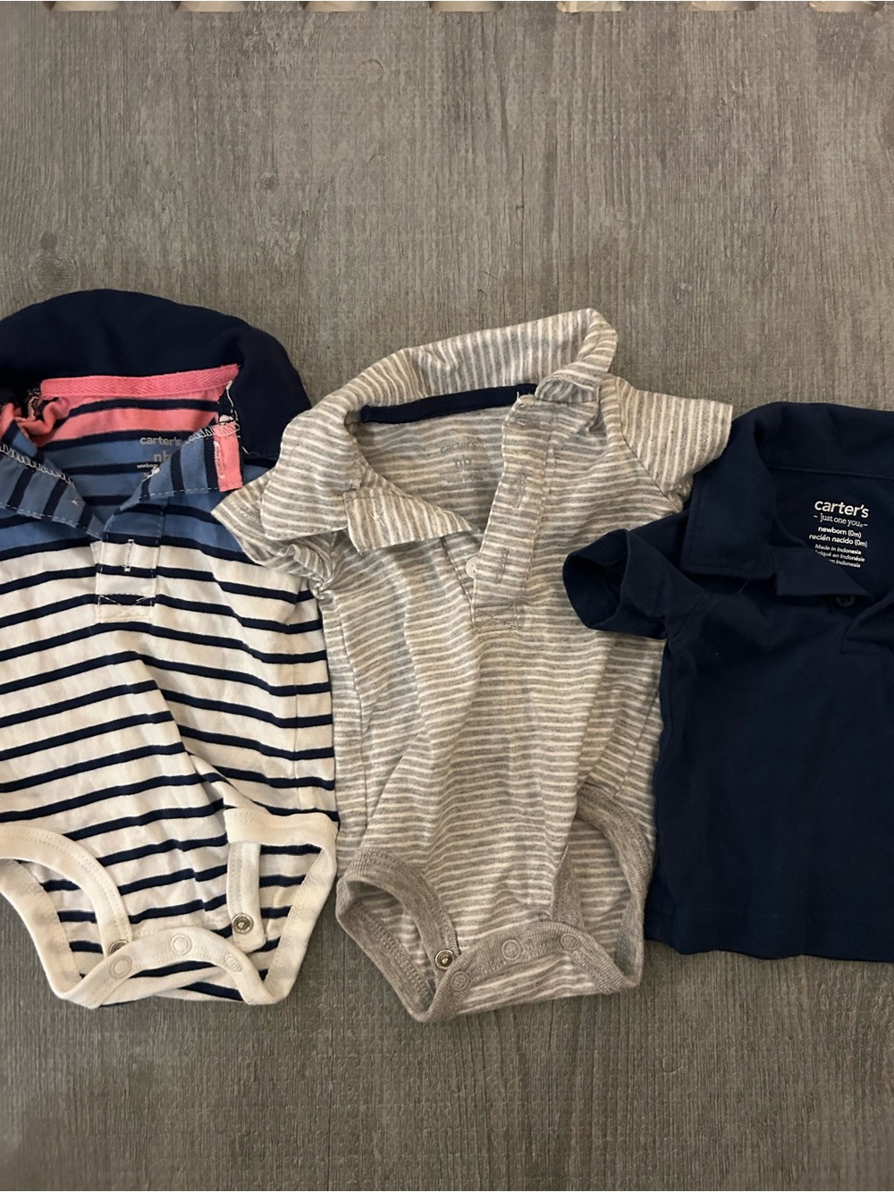 3 New born baby Carter's polo style shirts. (2 are onesies, & 1 is a shirt)